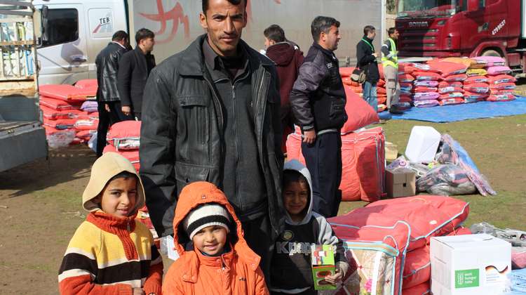 Vater mit Kindern in Mossul