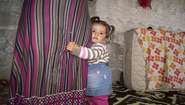 Family Latif, Syrian refugees in Turkey, girl in her house. 