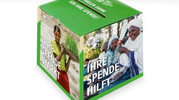 Abgebildet ist eine Spendenbox der Welthungerhilfe aus Pappe.