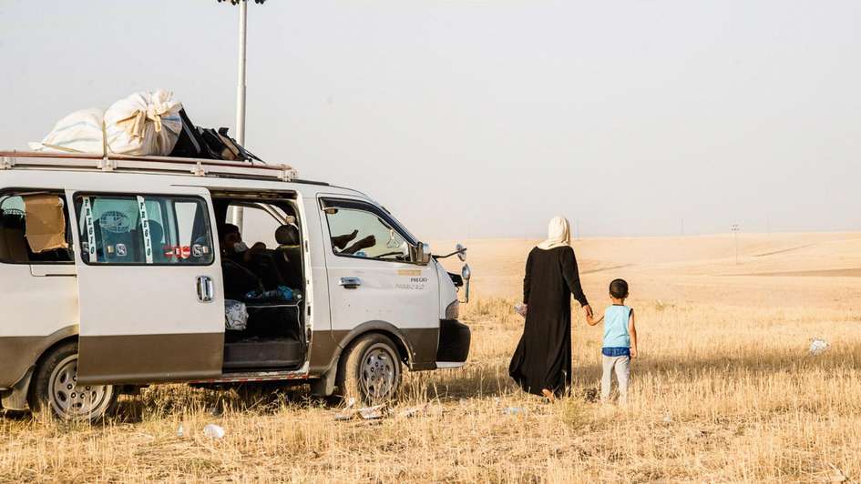 Mutter und Kind bei der Ankunft in der Kurdischen Region im Nordirak (RKI).